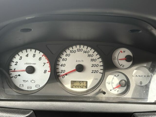 Чорний Міцубісі Lancer, об'ємом двигуна 1.6 л та пробігом 244 тис. км за 4999 $, фото 9 на Automoto.ua