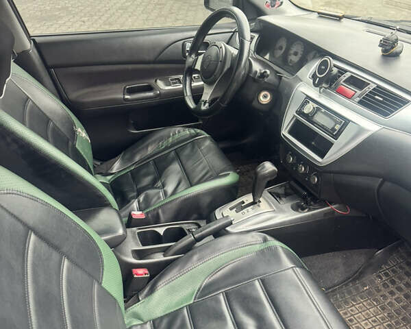 Чорний Міцубісі Lancer, об'ємом двигуна 2 л та пробігом 210 тис. км за 5500 $, фото 19 на Automoto.ua