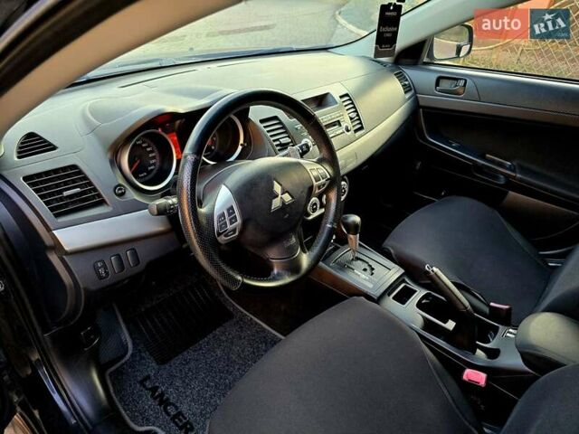 Чорний Міцубісі Lancer, об'ємом двигуна 2 л та пробігом 260 тис. км за 6555 $, фото 21 на Automoto.ua