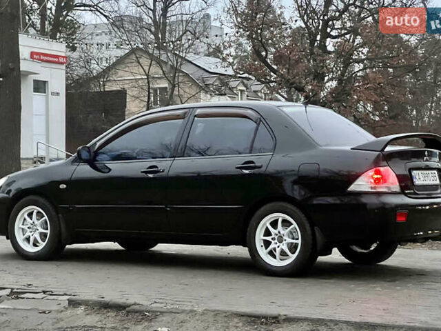 Чорний Міцубісі Lancer, об'ємом двигуна 1.6 л та пробігом 303 тис. км за 4350 $, фото 6 на Automoto.ua