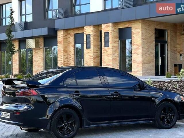 Черный Мицубиси Лансер, объемом двигателя 2 л и пробегом 205 тыс. км за 6500 $, фото 1 на Automoto.ua