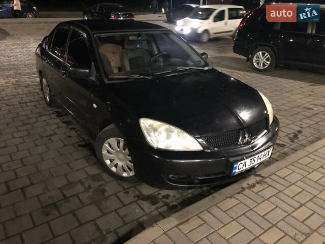 Чорний Міцубісі Lancer, об'ємом двигуна 1.6 л та пробігом 280 тис. км за 3800 $, фото 19 на Automoto.ua