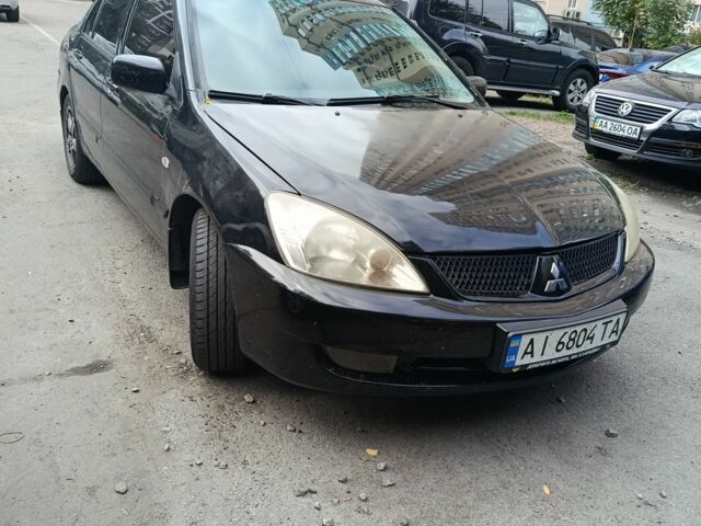 Чорний Міцубісі Lancer, об'ємом двигуна 1.6 л та пробігом 420 тис. км за 3650 $, фото 1 на Automoto.ua