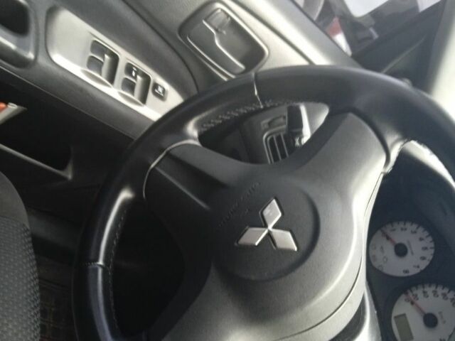 Черный Мицубиси Лансер, объемом двигателя 1.6 л и пробегом 223 тыс. км за 4300 $, фото 2 на Automoto.ua