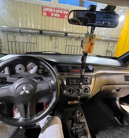 Черный Мицубиси Лансер, объемом двигателя 1.6 л и пробегом 249 тыс. км за 5000 $, фото 11 на Automoto.ua