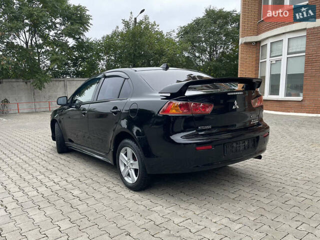 Черный Мицубиси Лансер, объемом двигателя 2 л и пробегом 200 тыс. км за 6199 $, фото 3 на Automoto.ua