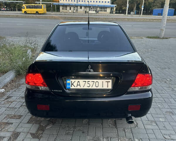 Черный Мицубиси Лансер, объемом двигателя 1.59 л и пробегом 269 тыс. км за 4999 $, фото 8 на Automoto.ua