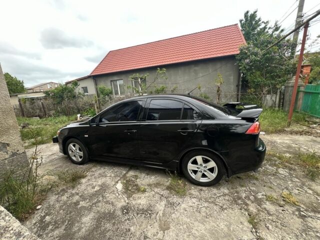 Черный Мицубиси Лансер, объемом двигателя 2 л и пробегом 200 тыс. км за 6900 $, фото 3 на Automoto.ua