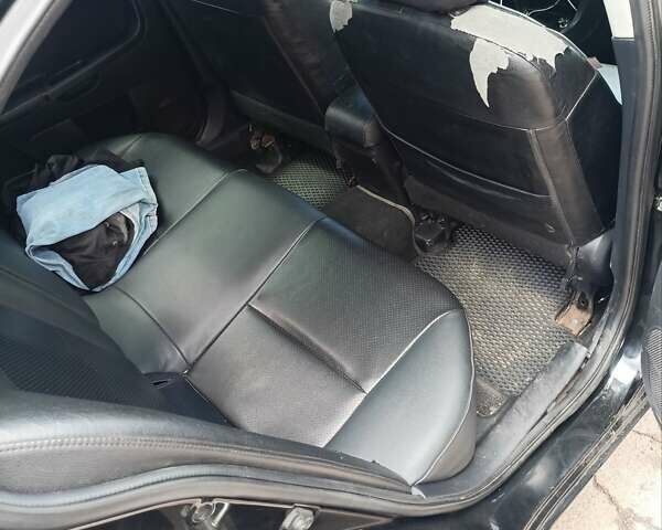 Черный Мицубиси Лансер, объемом двигателя 2 л и пробегом 280 тыс. км за 5700 $, фото 17 на Automoto.ua