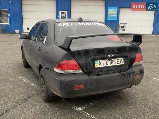 Черный Мицубиси Лансер, объемом двигателя 1.58 л и пробегом 263 тыс. км за 4000 $, фото 35 на Automoto.ua