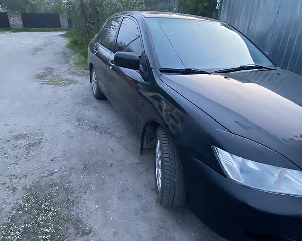 Чорний Міцубісі Lancer, об'ємом двигуна 1.6 л та пробігом 195 тис. км за 5200 $, фото 31 на Automoto.ua