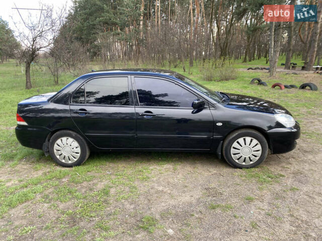 Чорний Міцубісі Lancer, об'ємом двигуна 1.6 л та пробігом 224 тис. км за 4950 $, фото 5 на Automoto.ua