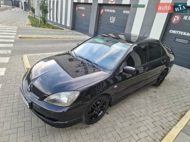 Чорний Міцубісі Lancer, об'ємом двигуна 2 л та пробігом 272 тис. км за 4750 $, фото 3 на Automoto.ua