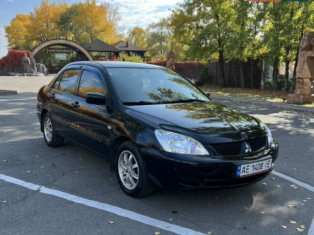 Чорний Міцубісі Lancer, об'ємом двигуна 1.58 л та пробігом 175 тис. км за 5200 $, фото 1 на Automoto.ua