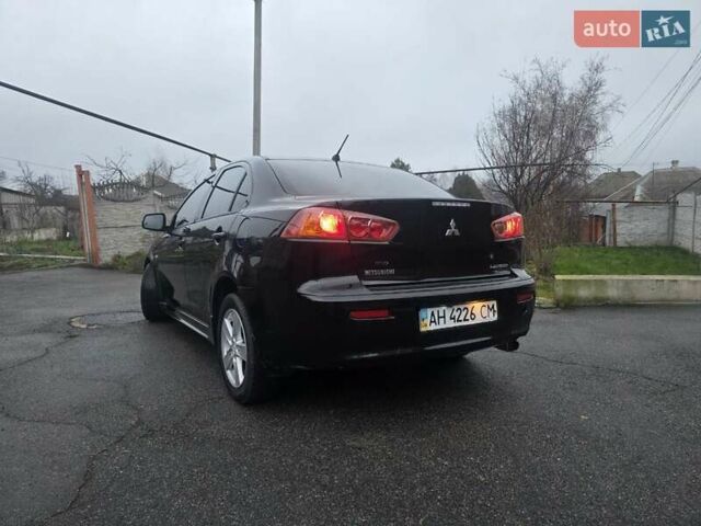 Черный Мицубиси Лансер, объемом двигателя 2 л и пробегом 116 тыс. км за 7200 $, фото 4 на Automoto.ua