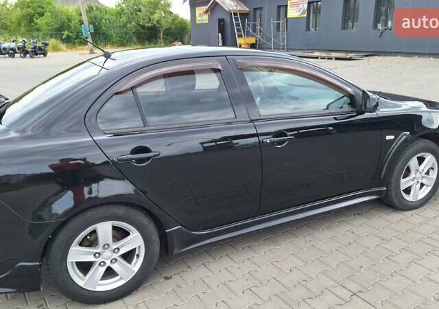 Чорний Міцубісі Lancer, об'ємом двигуна 2 л та пробігом 207 тис. км за 6500 $, фото 8 на Automoto.ua