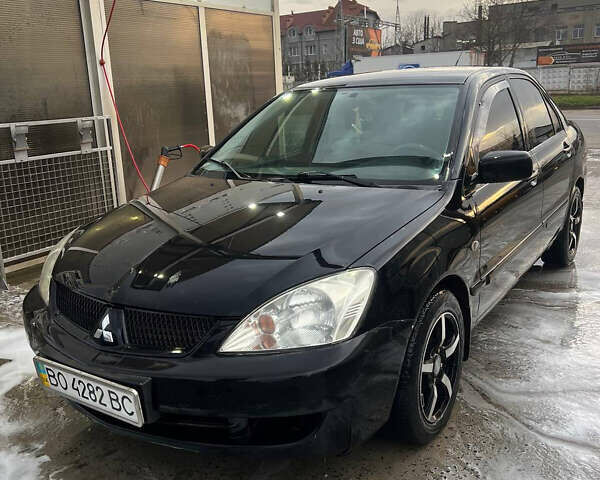 Черный Мицубиси Лансер, объемом двигателя 1.6 л и пробегом 180 тыс. км за 3499 $, фото 3 на Automoto.ua