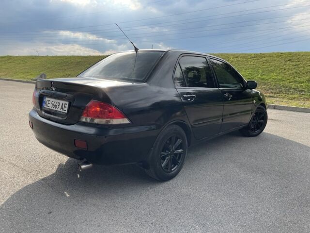Чорний Міцубісі Lancer, об'ємом двигуна 1.6 л та пробігом 260 тис. км за 4600 $, фото 5 на Automoto.ua