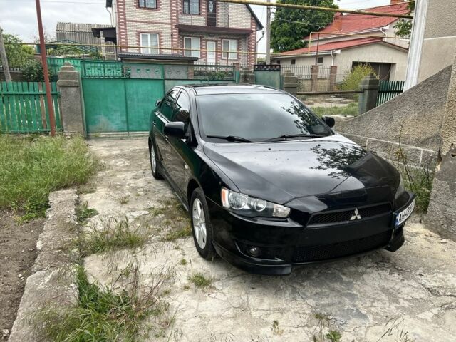 Черный Мицубиси Лансер, объемом двигателя 2 л и пробегом 200 тыс. км за 6900 $, фото 1 на Automoto.ua