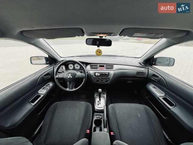 Чорний Міцубісі Lancer, об'ємом двигуна 1.6 л та пробігом 243 тис. км за 4950 $, фото 48 на Automoto.ua