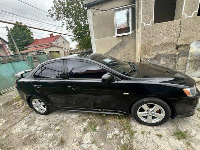 Черный Мицубиси Лансер, объемом двигателя 2 л и пробегом 200 тыс. км за 6900 $, фото 4 на Automoto.ua