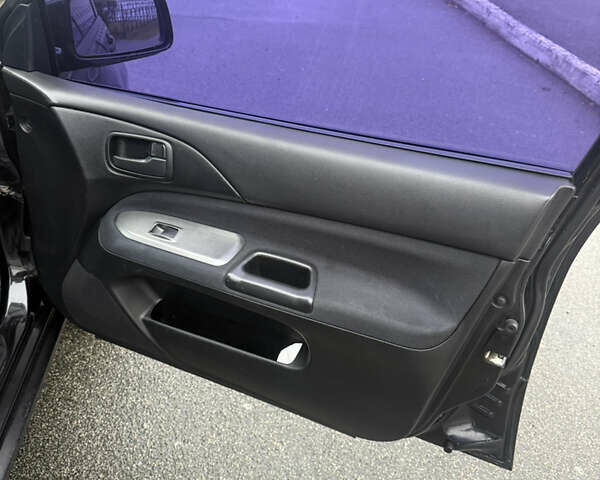 Чорний Міцубісі Lancer, об'ємом двигуна 1.58 л та пробігом 256 тис. км за 3700 $, фото 24 на Automoto.ua