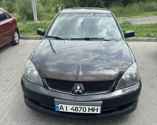 Чорний Міцубісі Lancer, об'ємом двигуна 2 л та пробігом 210 тис. км за 5500 $, фото 37 на Automoto.ua