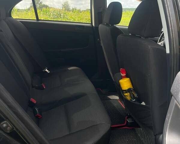 Чорний Міцубісі Lancer, об'ємом двигуна 2 л та пробігом 207 тис. км за 6500 $, фото 7 на Automoto.ua