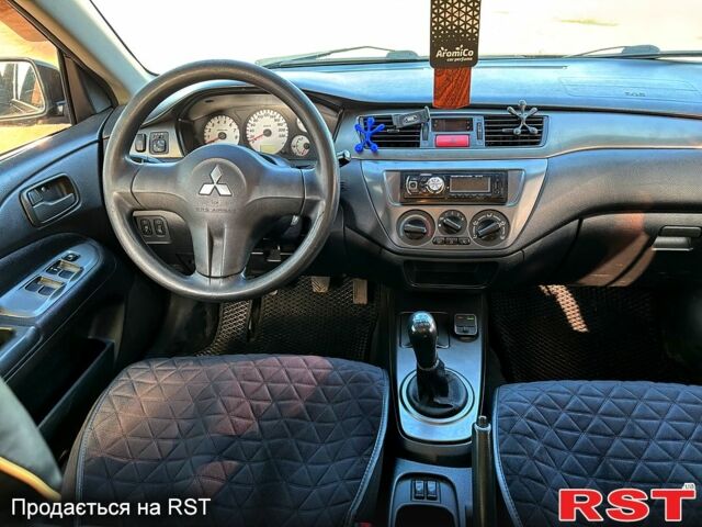 Черный Мицубиси Лансер, объемом двигателя 1.6 л и пробегом 249 тыс. км за 4444 $, фото 3 на Automoto.ua