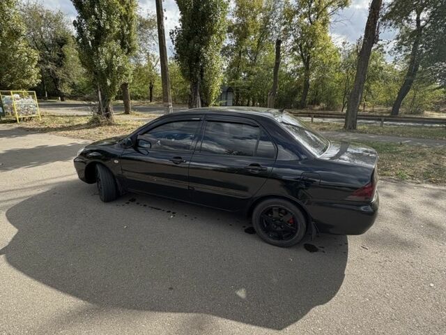 Чорний Міцубісі Lancer, об'ємом двигуна 1.6 л та пробігом 244 тис. км за 4999 $, фото 2 на Automoto.ua