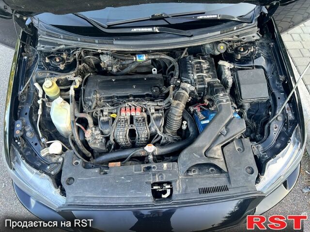 Черный Мицубиси Лансер, объемом двигателя 2 л и пробегом 216 тыс. км за 7500 $, фото 7 на Automoto.ua