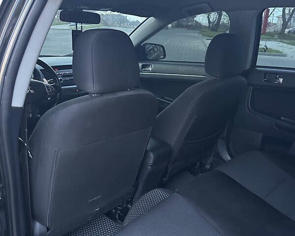 Черный Мицубиси Лансер, объемом двигателя 2 л и пробегом 245 тыс. км за 6200 $, фото 15 на Automoto.ua