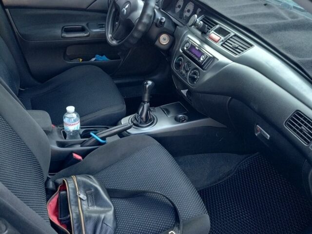 Черный Мицубиси Лансер, объемом двигателя 1.6 л и пробегом 301 тыс. км за 4300 $, фото 4 на Automoto.ua