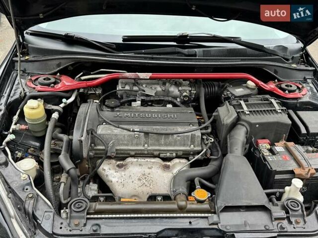Черный Мицубиси Лансер, объемом двигателя 2 л и пробегом 219 тыс. км за 4400 $, фото 7 на Automoto.ua