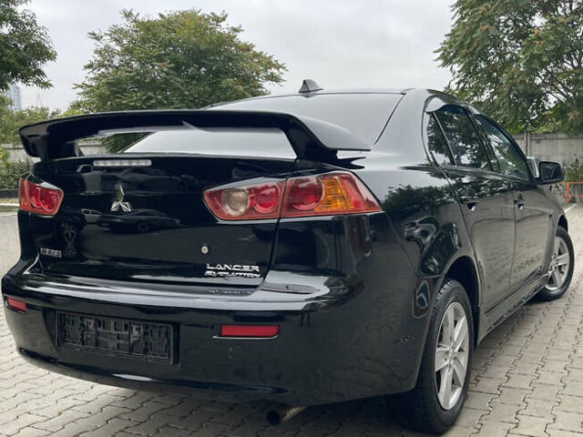Черный Мицубиси Лансер, объемом двигателя 2 л и пробегом 200 тыс. км за 6199 $, фото 4 на Automoto.ua