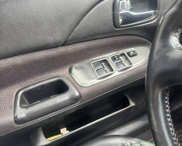 Чорний Міцубісі Lancer, об'ємом двигуна 2 л та пробігом 210 тис. км за 5500 $, фото 30 на Automoto.ua