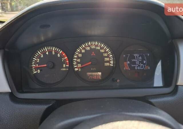 Чорний Міцубісі Lancer, об'ємом двигуна 2 л та пробігом 174 тис. км за 4800 $, фото 5 на Automoto.ua