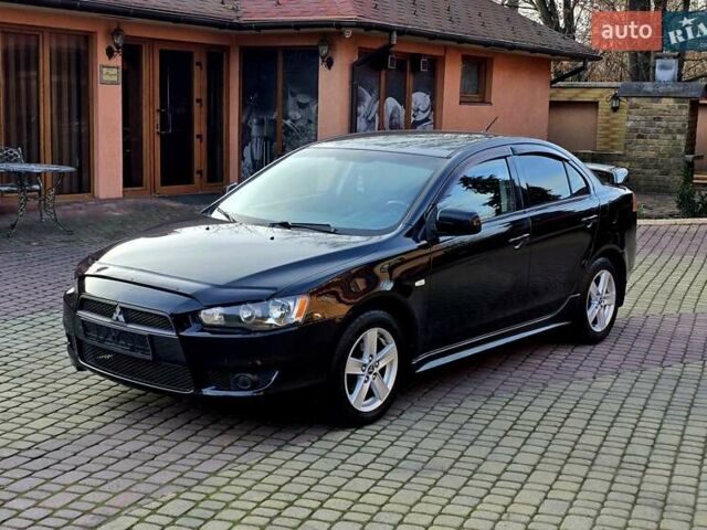 Чорний Міцубісі Lancer, об'ємом двигуна 2 л та пробігом 260 тис. км за 6555 $, фото 7 на Automoto.ua