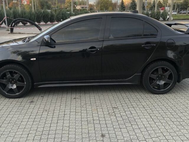 Чорний Міцубісі Lancer, об'ємом двигуна 2 л та пробігом 194 тис. км за 5950 $, фото 1 на Automoto.ua