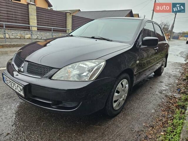 Черный Мицубиси Лансер, объемом двигателя 1.6 л и пробегом 152 тыс. км за 4999 $, фото 4 на Automoto.ua