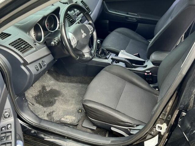 Черный Мицубиси Лансер, объемом двигателя 2 л и пробегом 200 тыс. км за 6900 $, фото 7 на Automoto.ua