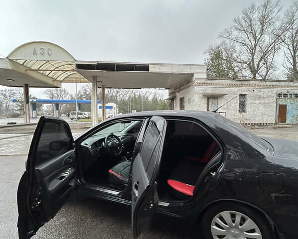 Черный Мицубиси Лансер, объемом двигателя 1.58 л и пробегом 254 тыс. км за 5000 $, фото 13 на Automoto.ua