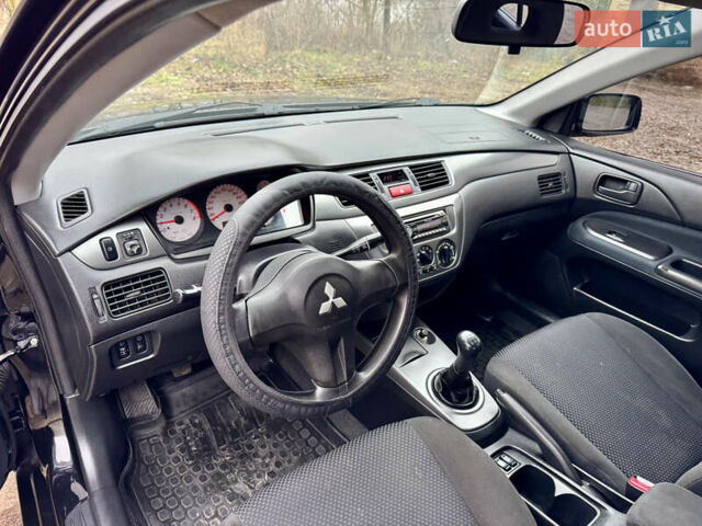 Черный Мицубиси Лансер, объемом двигателя 1.6 л и пробегом 216 тыс. км за 4990 $, фото 11 на Automoto.ua