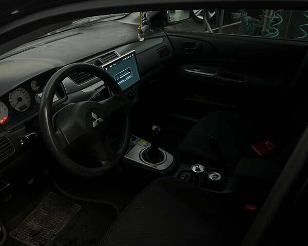 Черный Мицубиси Лансер, объемом двигателя 1.6 л и пробегом 180 тыс. км за 3499 $, фото 20 на Automoto.ua