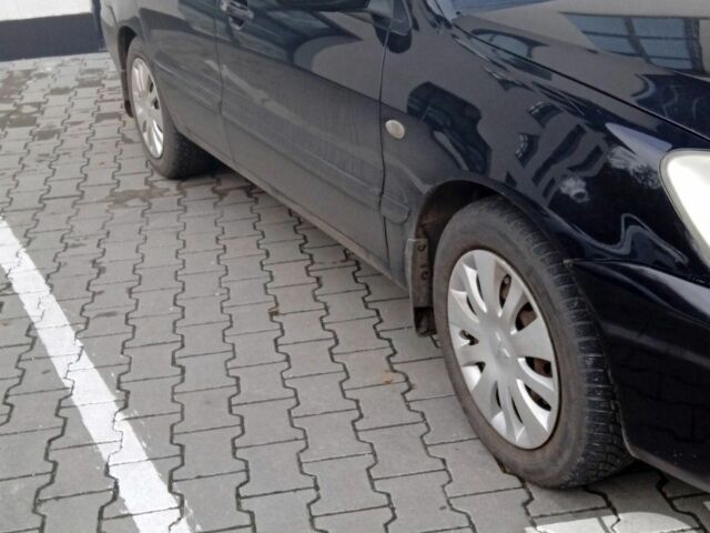 Черный Мицубиси Лансер, объемом двигателя 1.6 л и пробегом 223 тыс. км за 4300 $, фото 1 на Automoto.ua