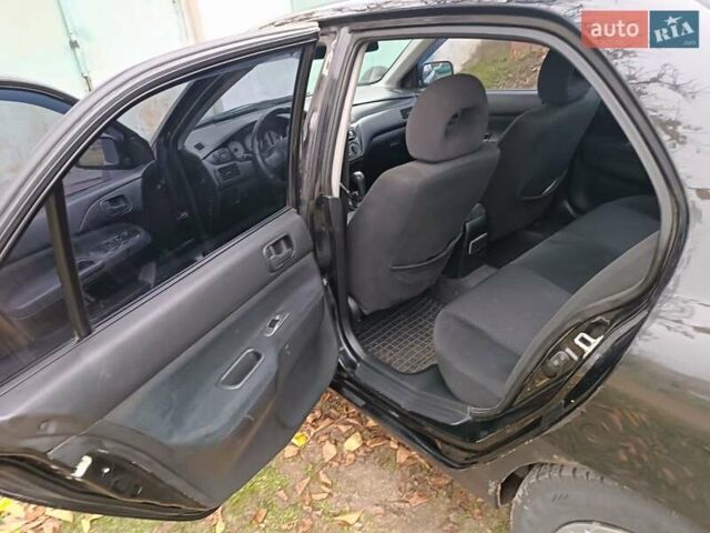 Чорний Міцубісі Lancer, об'ємом двигуна 1.58 л та пробігом 227 тис. км за 4100 $, фото 9 на Automoto.ua