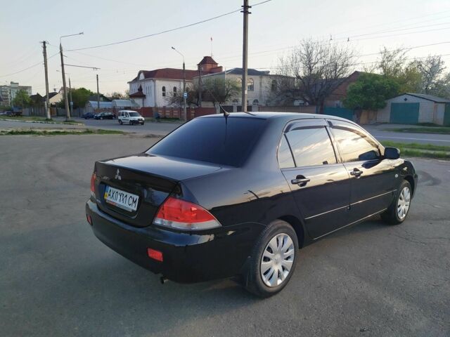 Черный Мицубиси Лансер, объемом двигателя 1.6 л и пробегом 32 тыс. км за 9000 $, фото 16 на Automoto.ua