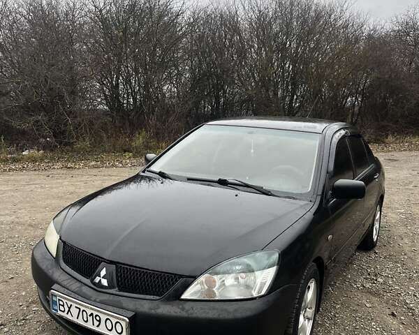 Черный Мицубиси Лансер, объемом двигателя 1.6 л и пробегом 272 тыс. км за 2800 $, фото 9 на Automoto.ua