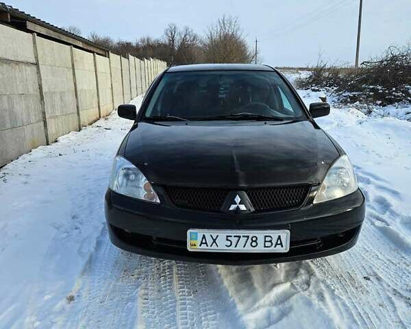 Чорний Міцубісі Lancer, об'ємом двигуна 1.6 л та пробігом 240 тис. км за 3500 $, фото 1 на Automoto.ua