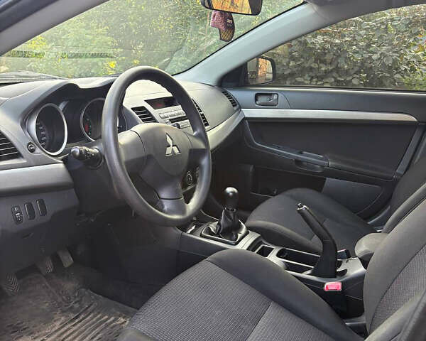 Черный Мицубиси Лансер, объемом двигателя 1.5 л и пробегом 111 тыс. км за 7500 $, фото 17 на Automoto.ua